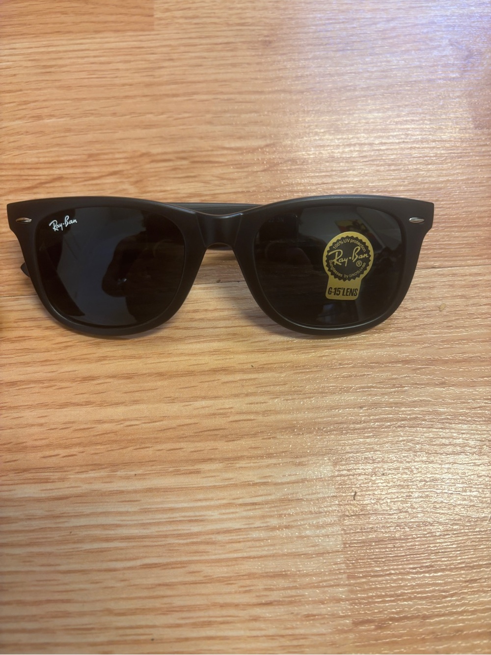 Sunglasses on wooden surface